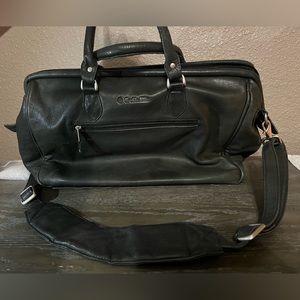 Leather bag. 12 inches tall X 17 inches long X 7 inches wide.